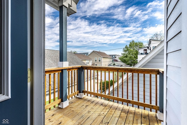wooden deck with a residential view