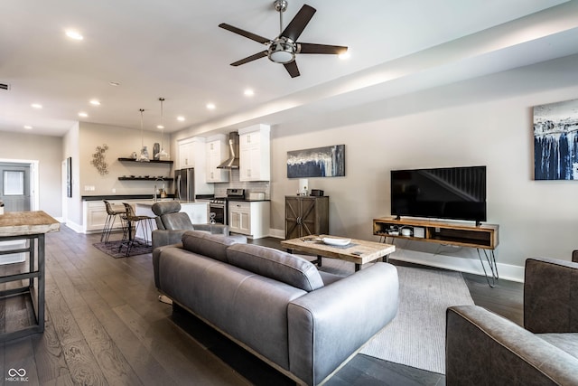 living room with baseboards, dark wood-style flooring, ceiling fan, and recessed lighting