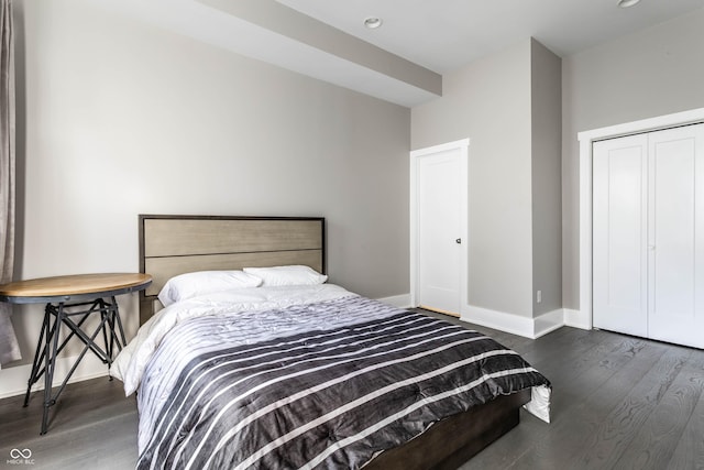 bedroom with wood finished floors, baseboards, and recessed lighting