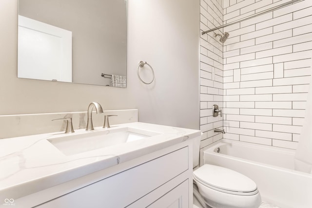 bathroom with toilet, vanity, and bathtub / shower combination