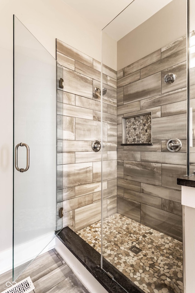 bathroom featuring a shower stall