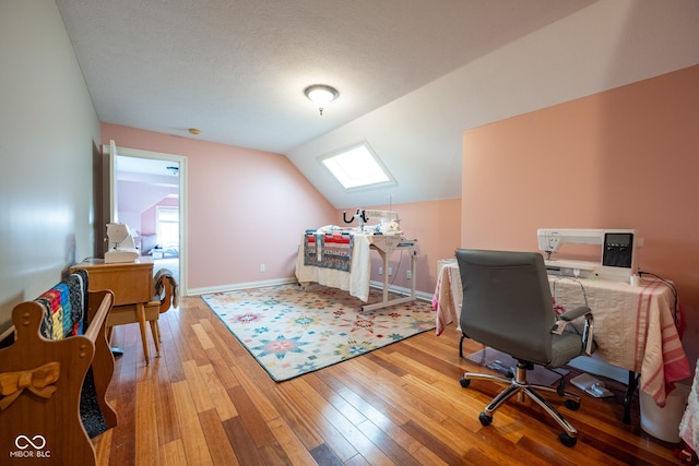 4890 Benthaven Dr E, Bargersville, IN 46106 - office with wood-type flooring, vaulted ceiling, and baseboards