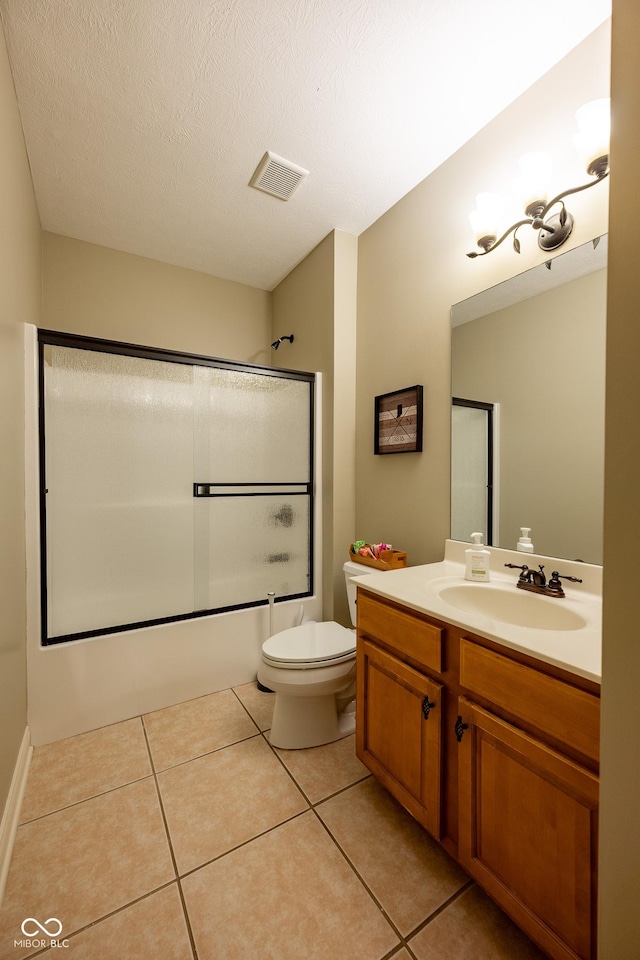 4890 Benthaven Dr E, Bargersville, IN 46106 - bathroom with enclosed tub / shower combo, vanity, toilet, tile patterned floors, and a textured ceiling