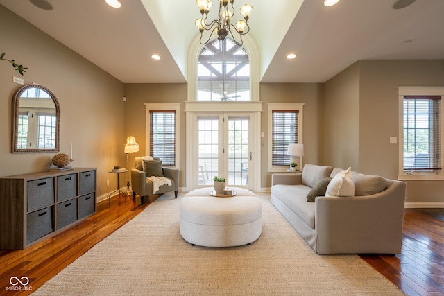 4890 Benthaven Dr E, Bargersville, IN 46106 - living room featuring vaulted ceiling, a chandelier, recessed lighting, wood finished floors, and baseboards