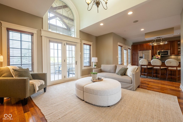 4890 Benthaven Dr E, Bargersville, IN 46106 - living room featuring wood finished floors, a chandelier, recessed lighting, and a towering ceiling