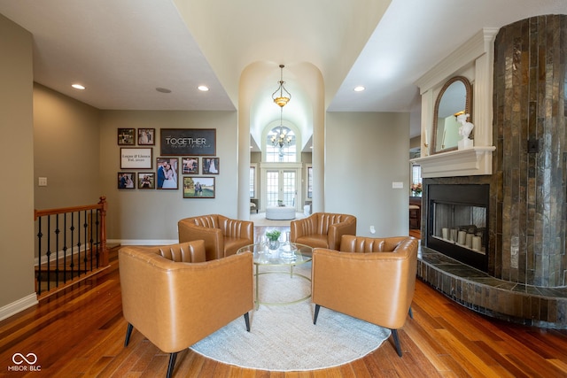 4890 Benthaven Dr E, Bargersville, IN 46106 - living room with wood finished floors, a glass covered fireplace, recessed lighting, a chandelier, and baseboards