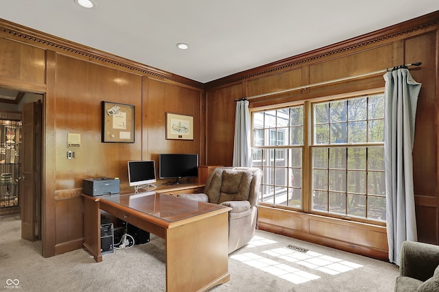 home office featuring light carpet, ornamental molding, wooden walls, and recessed lighting