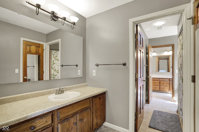 bathroom featuring vanity and baseboards