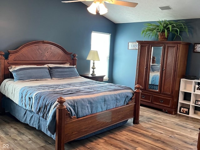 14058 Southwood Cir, Fishers, IN 46037 - bedroom featuring lofted ceiling, wood finished floors, and a ceiling fan