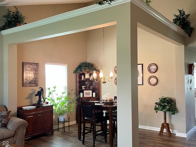 14058 Southwood Cir, Fishers, IN 46037 - dining area with dark wood finished floors, a chandelier, baseboards, vaulted ceiling, and ornamental molding
