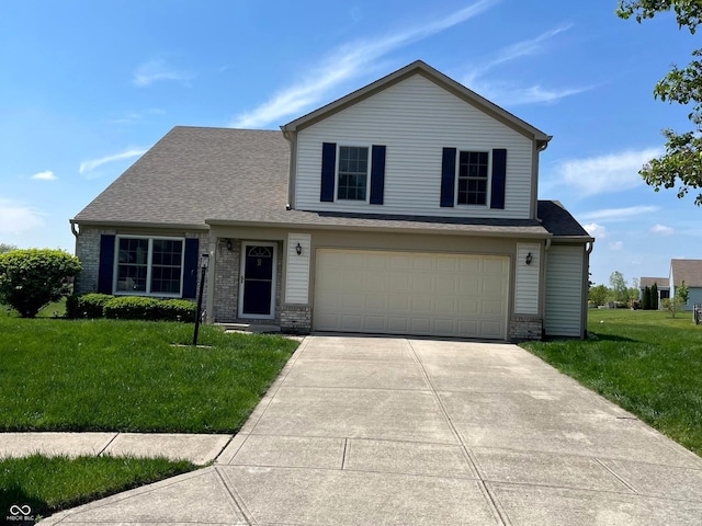 14058 Southwood Cir, Fishers, IN 46037 - traditional-style home featuring brick siding, driveway, a front lawn, and a garage