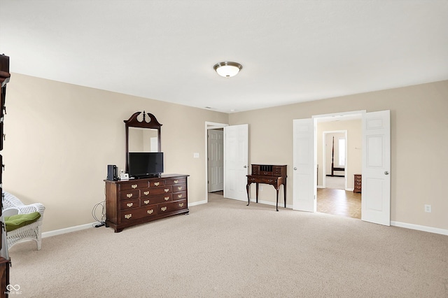 bedroom with carpet flooring and baseboards