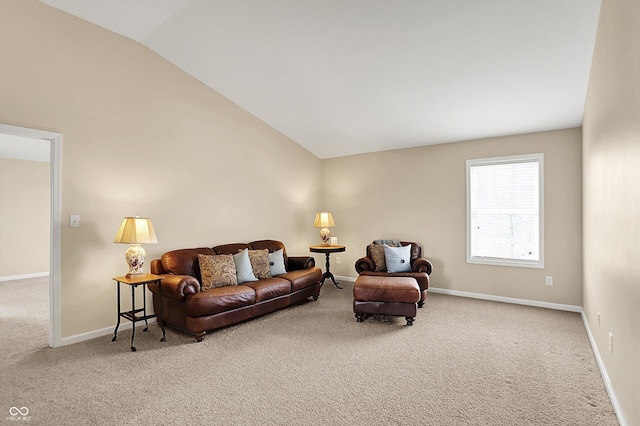carpeted living room with vaulted ceiling and baseboards