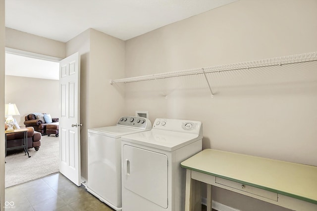 laundry area featuring independent washer and dryer and carpet