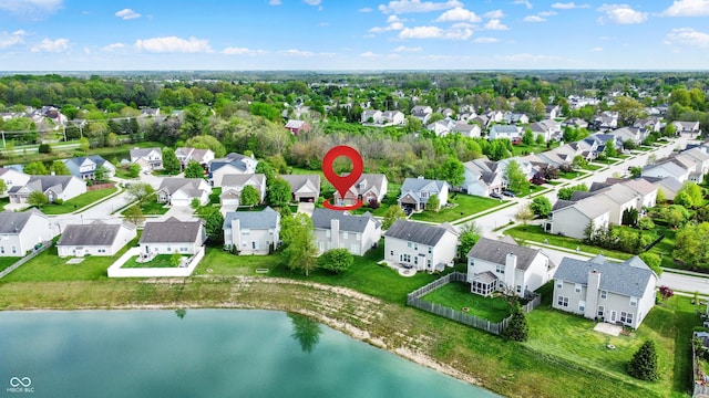 aerial view of residential area with a nearby body of water