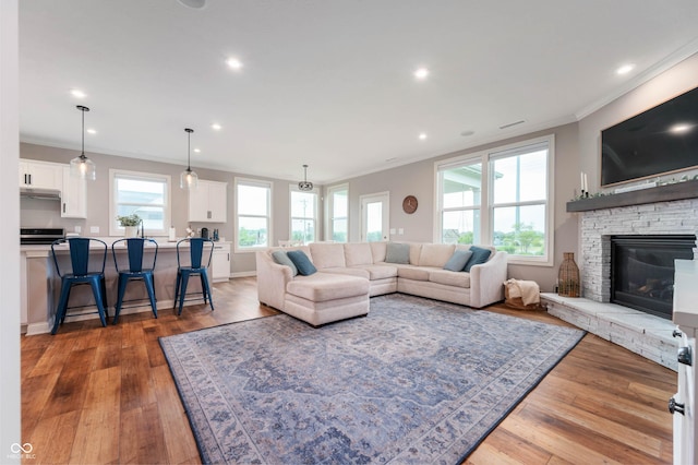 16270 Northwind Ct, Westfield, IN 46074 - living area with ornamental molding, wood finished floors, recessed lighting, a fireplace, and baseboards