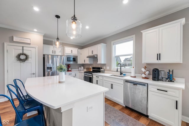 16270 Northwind Ct, Westfield, IN 46074 - kitchen with stainless steel appliances, a sink, light wood-type flooring, white cabinets, and recessed lighting