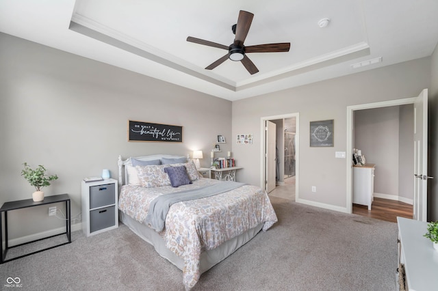 16270 Northwind Ct, Westfield, IN 46074 - bedroom featuring a raised ceiling, carpet floors, baseboards, crown molding, and a ceiling fan