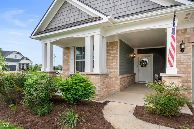 16270 Northwind Ct, Westfield, IN 46074 - property entrance featuring brick siding and a porch