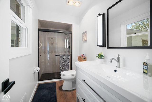 6673 Karyn Dr, Avon, IN 46123 - bathroom featuring toilet, a stall shower, vanity, and wood finished floors