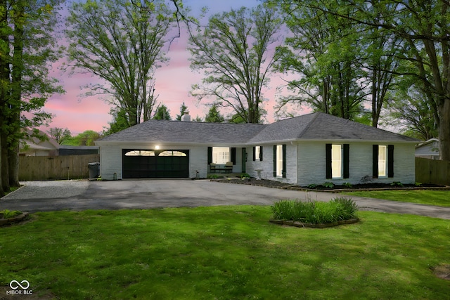 6673 Karyn Dr, Avon, IN 46123 - single story home featuring asphalt driveway, an attached garage, and brick siding