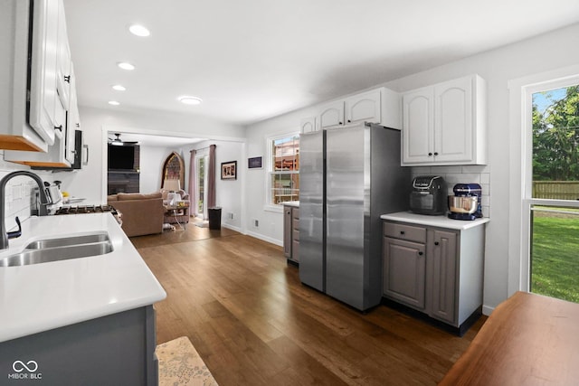 6673 Karyn Dr, Avon, IN 46123 - kitchen featuring freestanding refrigerator, a sink, recessed lighting, white cabinetry, and dark wood finished floors