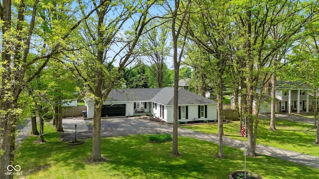 6673 Karyn Dr, Avon, IN 46123 - ranch-style home featuring an attached garage, asphalt driveway, and a shingled roof