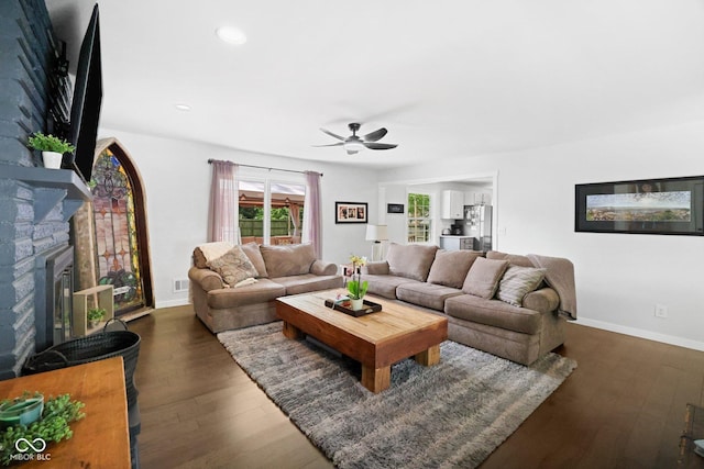 6673 Karyn Dr, Avon, IN 46123 - living room with ceiling fan, dark wood-style floors, baseboards, a fireplace, and recessed lighting