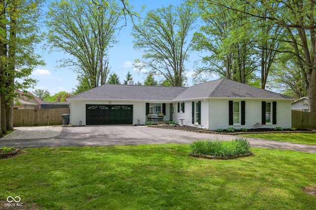 6673 Karyn Dr, Avon, IN 46123 - single story home with an attached garage, driveway, brick siding, and a shingled roof