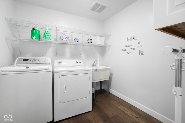 6673 Karyn Dr, Avon, IN 46123 - washroom featuring washing machine and clothes dryer, dark wood-style floors, and baseboards