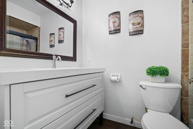 6673 Karyn Dr, Avon, IN 46123 - full bath with toilet, baseboards, vanity, and tiled shower