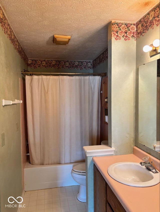 full bath featuring toilet, shower / tub combo, vanity, tile patterned floors, and a textured ceiling