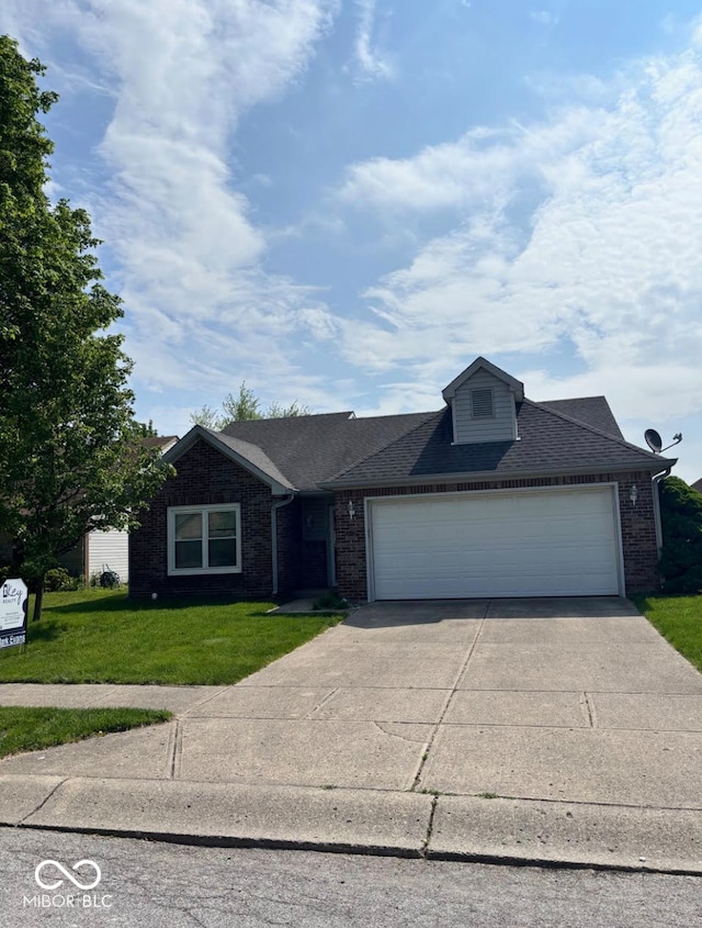 single story home featuring concrete driveway, brick siding, a garage, and a front yard