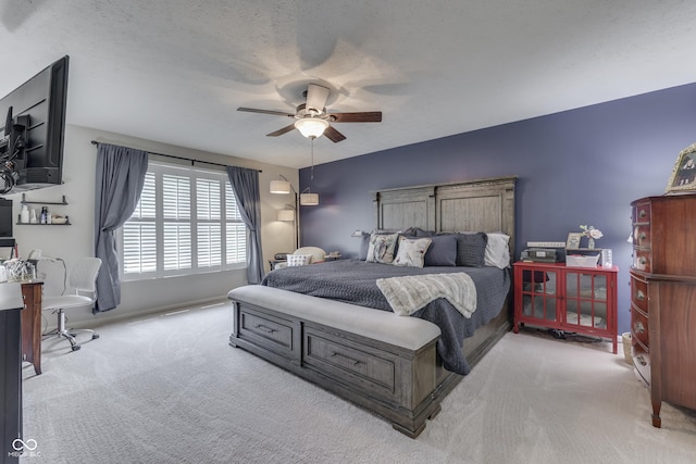 bedroom with carpet floors and a ceiling fan