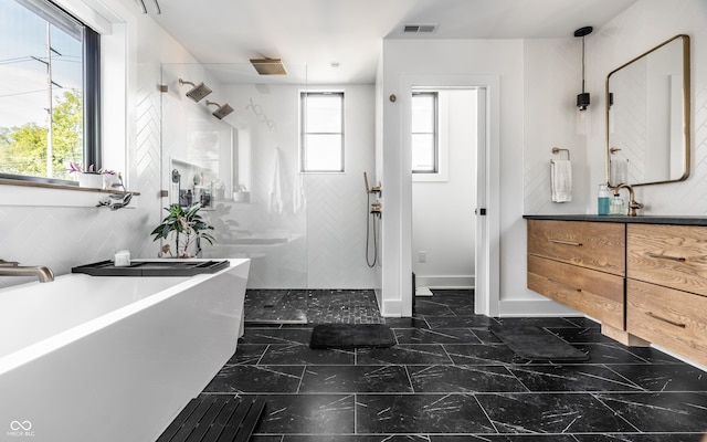 2036 Central Ave, Indianapolis, IN 46202 - full bathroom with walk in shower, vanity, marble finish flooring, and a freestanding tub