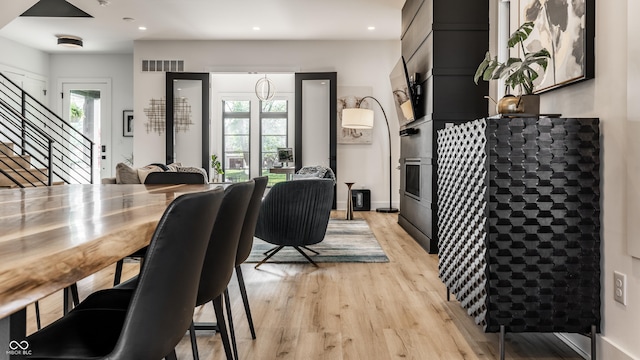2036 Central Ave, Indianapolis, IN 46202 - dining space with light wood-style flooring, stairs, and recessed lighting