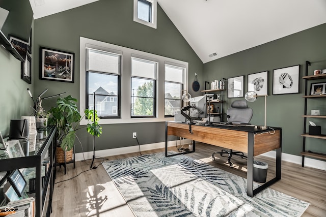 2036 Central Ave, Indianapolis, IN 46202 - office area featuring high vaulted ceiling, plenty of natural light, wood finished floors, and baseboards