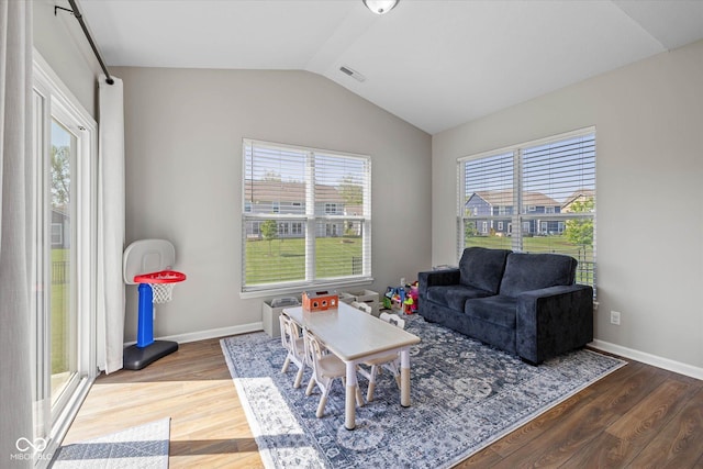 5375 Citadel Dr, Noblesville, IN 46062 - living area featuring vaulted ceiling, wood finished floors, and baseboards