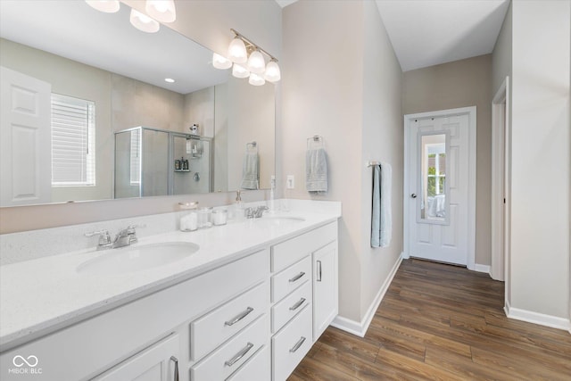 5375 Citadel Dr, Noblesville, IN 46062 - full bath with wood finished floors, double vanity, a shower stall, and baseboards