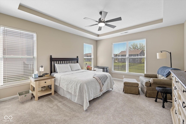 5375 Citadel Dr, Noblesville, IN 46062 - bedroom featuring a tray ceiling, light carpet, baseboards, and a ceiling fan