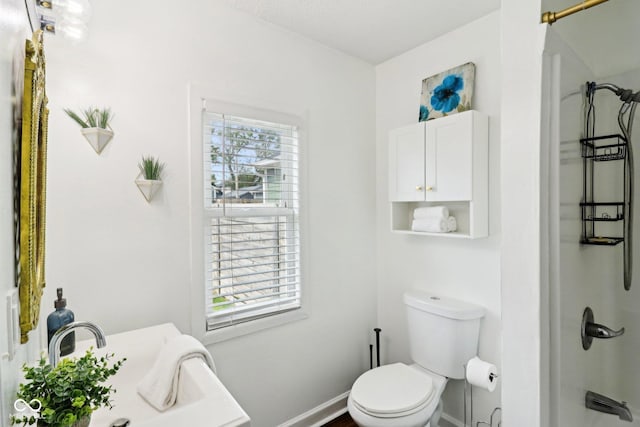 253 E Minnesota St, Indianapolis, IN 46225 - bathroom featuring toilet, a shower, and baseboards