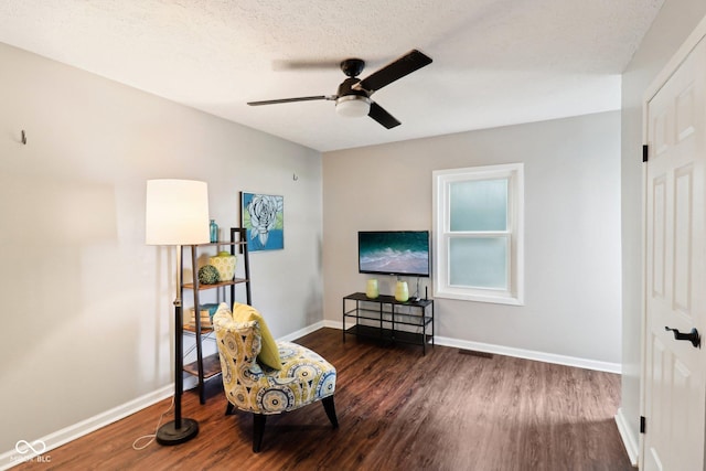 253 E Minnesota St, Indianapolis, IN 46225 - living area with dark wood finished floors, a ceiling fan, and baseboards