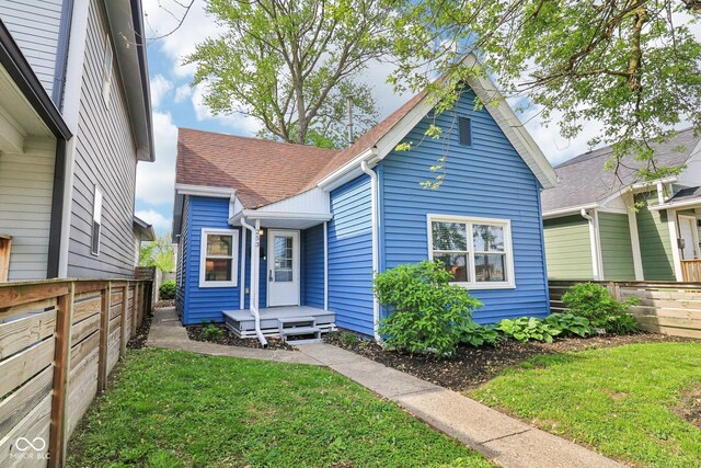 253 E Minnesota St, Indianapolis, IN 46225 - shotgun-style home featuring roof with shingles