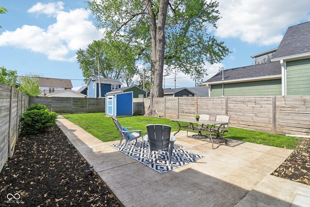 253 E Minnesota St, Indianapolis, IN 46225 - view of patio / terrace with a storage unit, an outbuilding, and outdoor dining area