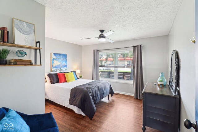 253 E Minnesota St, Indianapolis, IN 46225 - bedroom with wood finished floors, a textured ceiling, ceiling fan, and baseboards