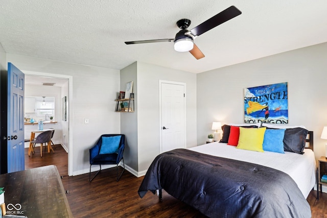 253 E Minnesota St, Indianapolis, IN 46225 - bedroom with wood finished floors, baseboards, ceiling fan, and a textured ceiling
