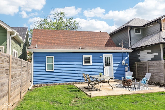 253 E Minnesota St, Indianapolis, IN 46225 - back of property with roof with shingles, a patio, and a fire pit