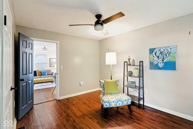 253 E Minnesota St, Indianapolis, IN 46225 - sitting room featuring wood finished floors, ceiling fan, and baseboards