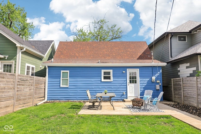 253 E Minnesota St, Indianapolis, IN 46225 - back of property featuring a fire pit, a shingled roof, and a patio area