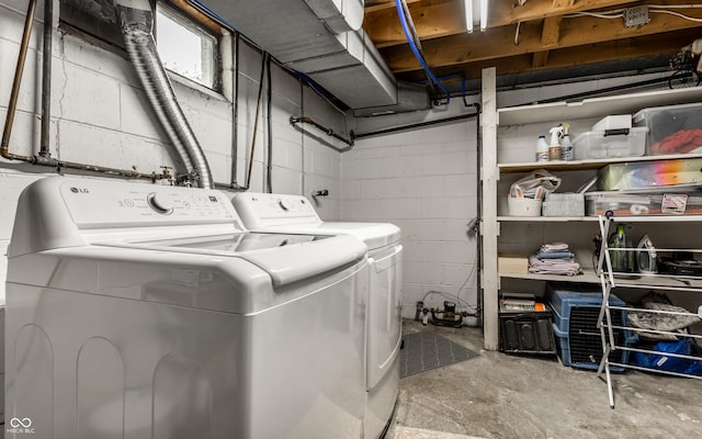 laundry area featuring washing machine and clothes dryer